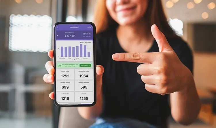 Woman-Showing-BladePro-Dashboard-on-her-phone-1