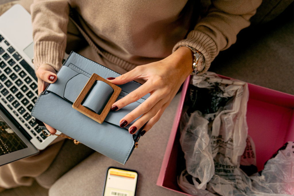 Woman's Hands holding a Luxurious bag straight out from the box